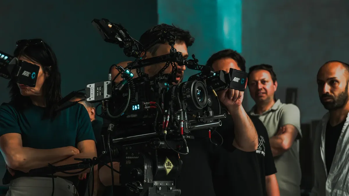 Film crew operating advanced cinema equipment on a set in Istanbul, showcasing teamwork.