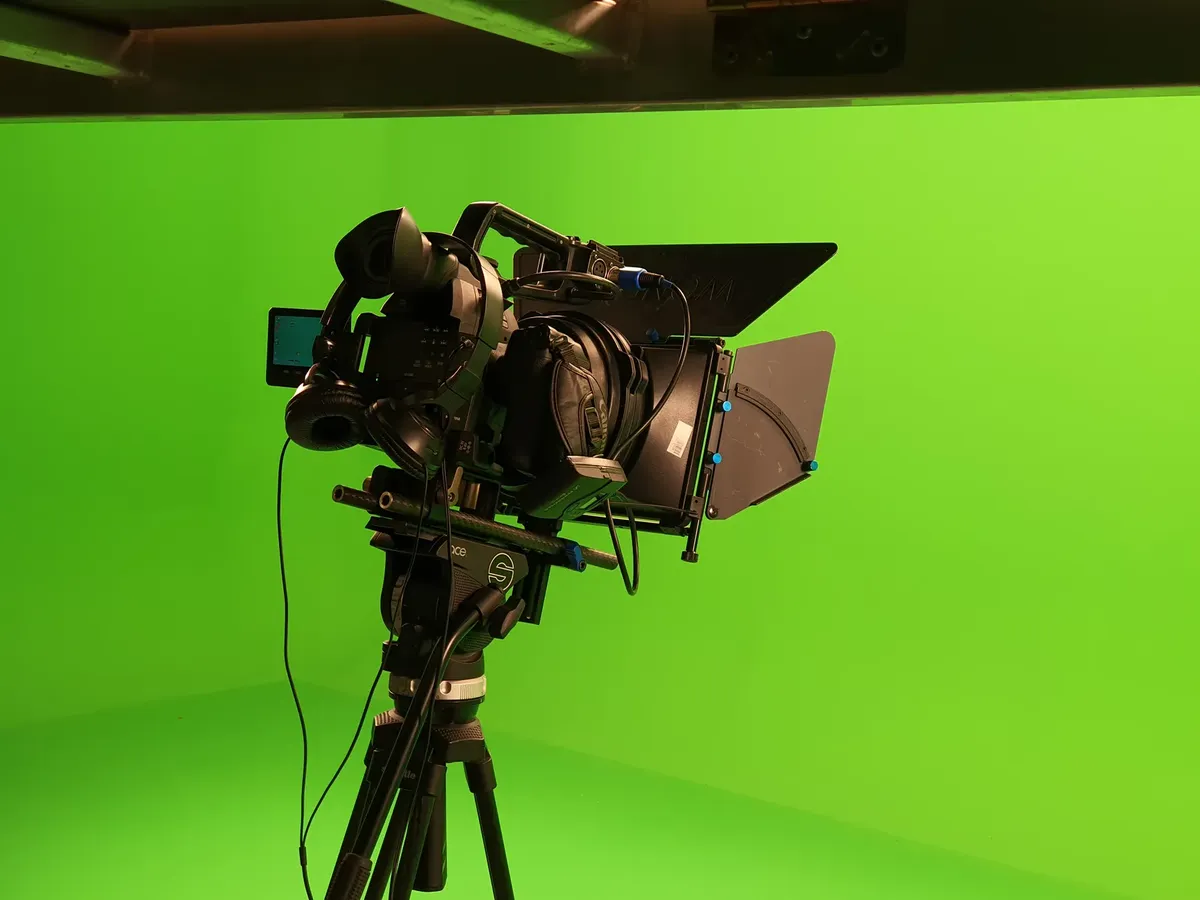 High-quality video camera setup in a green screen studio, ideal for film production.