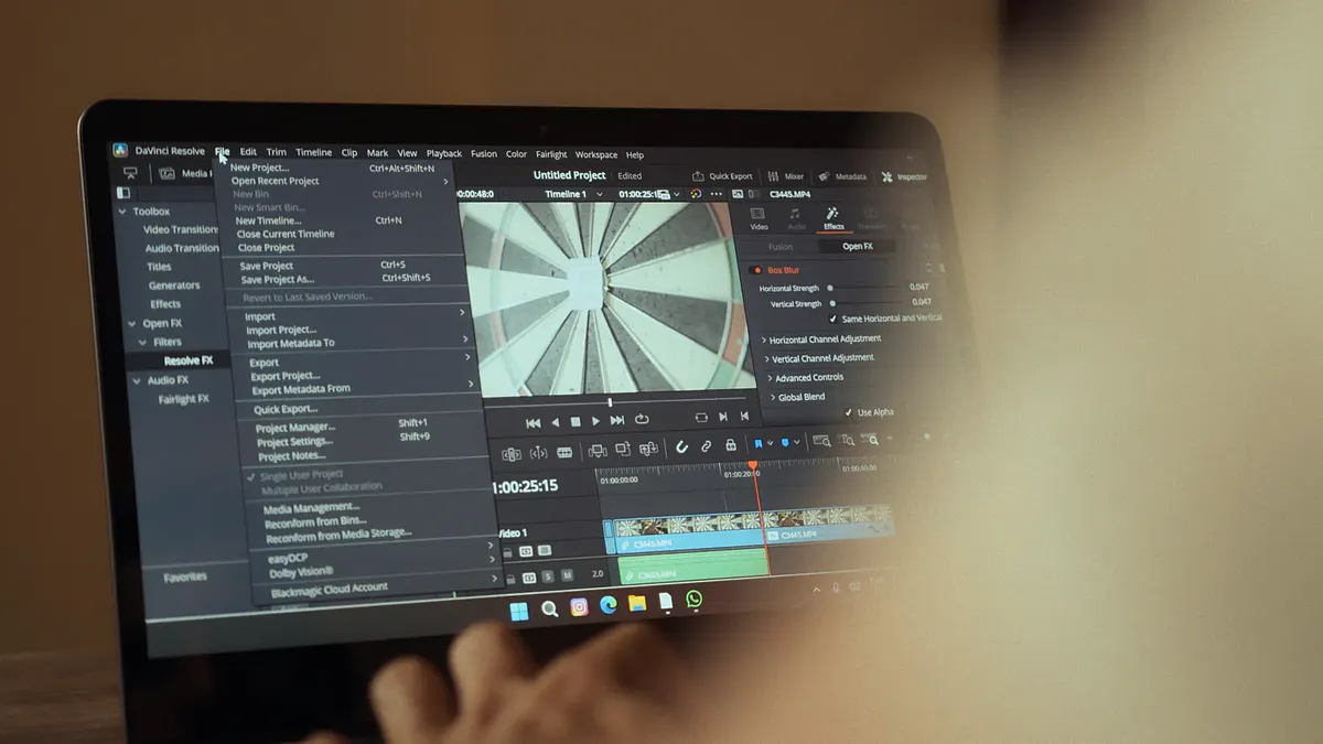Laptop displaying video editing software interface for cinematic storytelling.