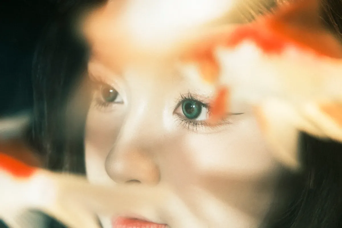 Artistic portrait with koi fish provides a dreamlike ambiance.