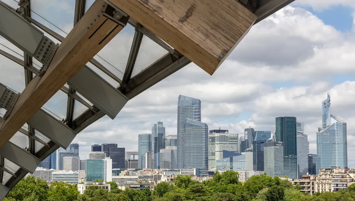 Stunning skyline view of La Défense in Paris with modern architecture and green surroundings.
