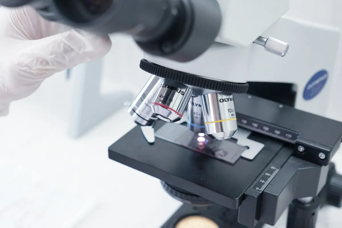 Detailed view of a microscope in a laboratory used in scientific research.