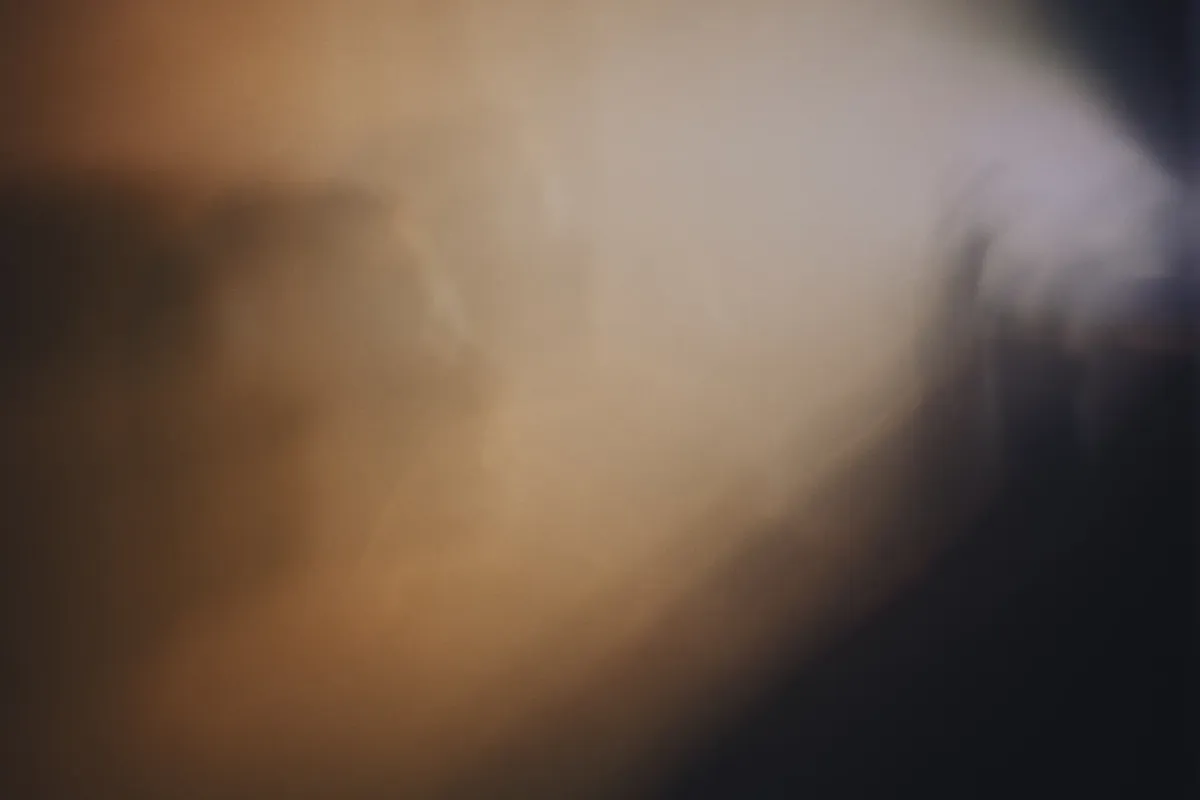 Evocative abstract image featuring a mysterious muted light and shadow play creating a liminal space feeling.