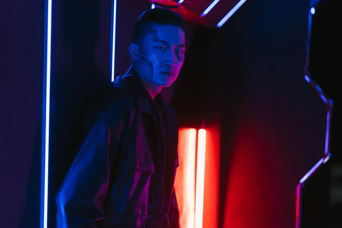 A man in a cyberpunk setting with dramatic neon lighting, exuding a futuristic vibe.